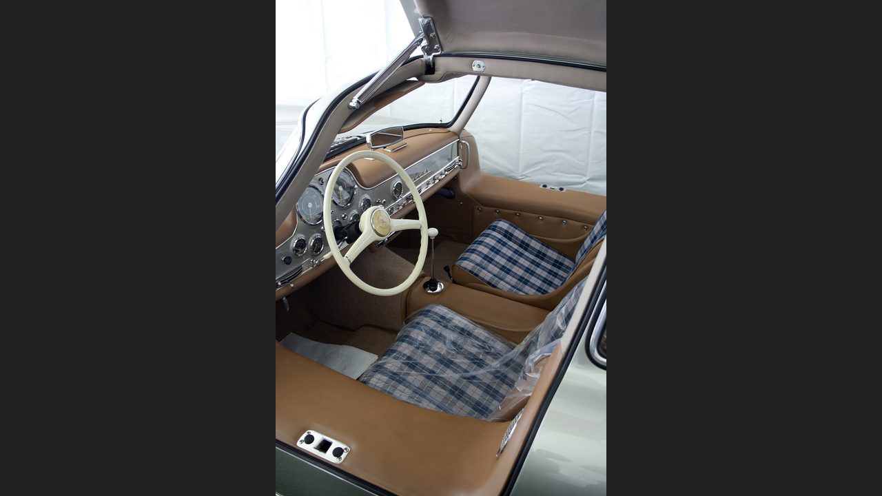 Restored Gullwing with the classic checked (plaid) cloth seats