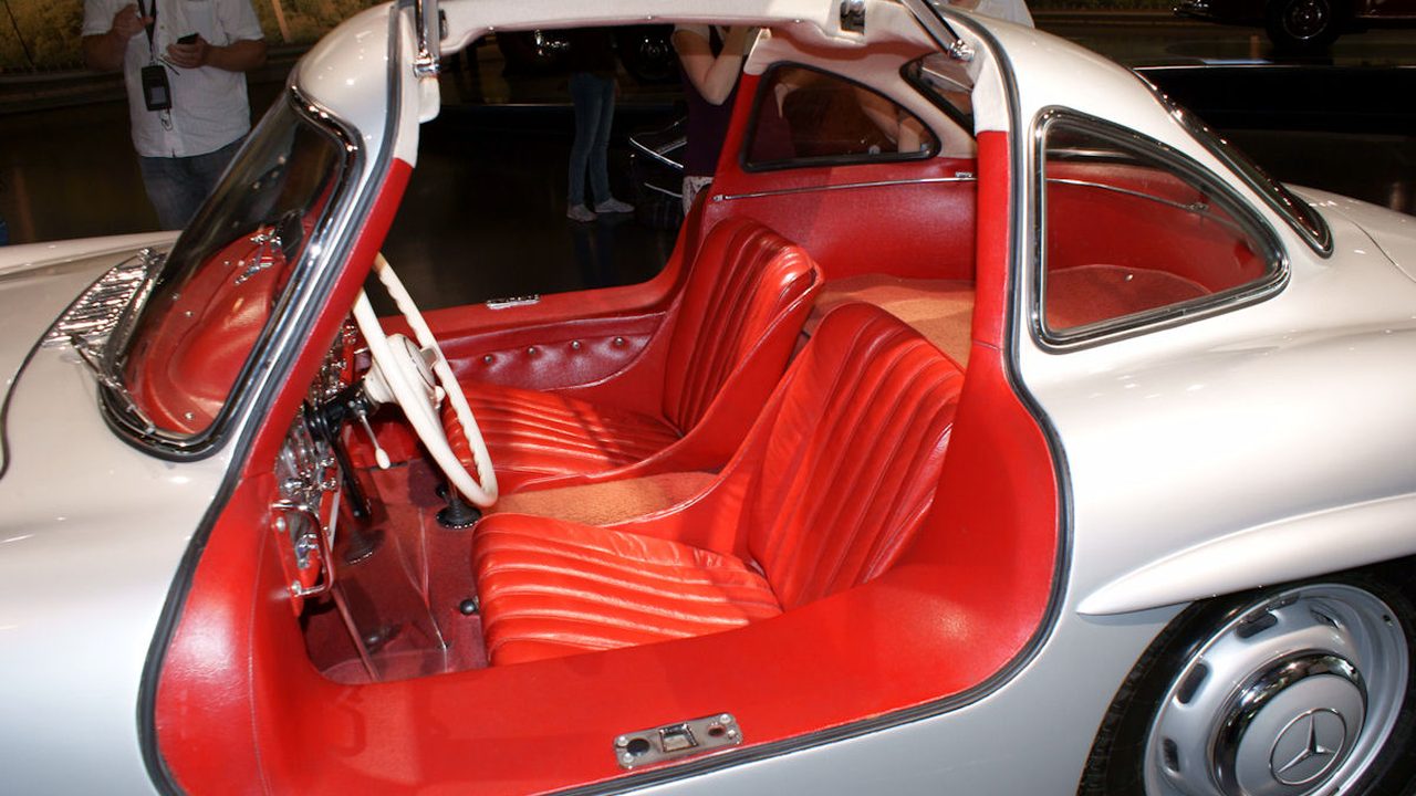 Gullwing door open at the Mercedes-Benz Museum: the high, wide sill of the tubular space frame you have to step over to get in